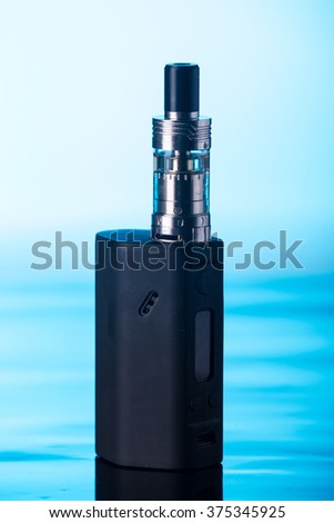 photos of electronic cigarette dark blue glossy background