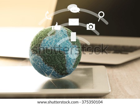 mock up the globe with digital social media network on screen laptop computer.