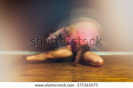 Modern hip hop dancer woman in motion blur