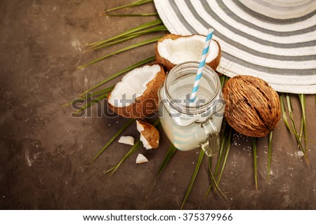 Fresh Organic Coconut Water in a Glass. Food background, selective focus Royalty-Free Stock Photo #375379966