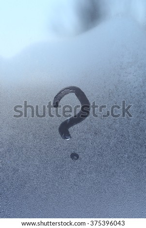 macro question mark drawn with your finger on the frozen glass