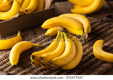 Raw Organic Bunch of Bananas Ready to Eat Royalty-Free Stock Photo #375477427