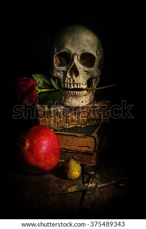 still life picture with a skull having a rose between the teeth, antique books, fruits and scissors, processed with a light grunge texture