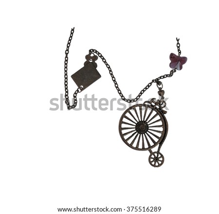 Bronze pendant bicycle and glass heart isolated on the white background