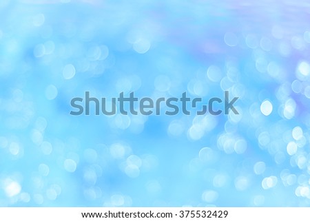 Unfocused abstract blue glitter holiday background