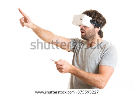 surprised man using virtual reality goggles