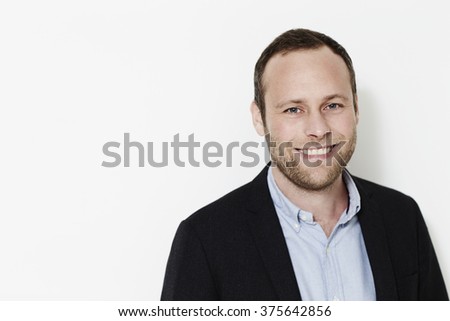 Smiling businessman in suit jacket