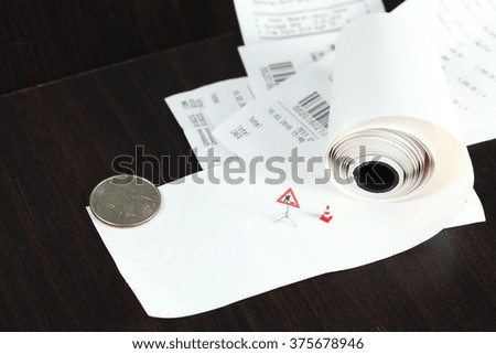 The receipt and plastic traffic maintenance signage miniature model represent the business and finance concept related idea. 