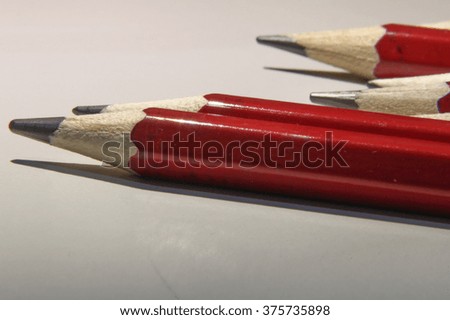 Red pencils close up macro photo