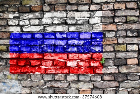 Flag of Russia painted on an old brick wall with small ivy plant growing out of a crack.