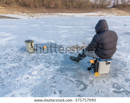Beautiful winter landscape on the river. River in ice. Winter fishing