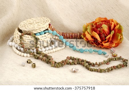 Basket of semi-precious stones on gunny background - gems for handmade