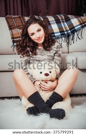 Sweet home, life style. Young beautiful woman at home. Sweet dreams and good morning, new day, weekend. With teddy bear. 