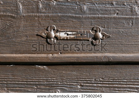 lombardy  italy   cross castellanza blur   abstract   rusty brass brown knocker in a  door curch  closed wood
