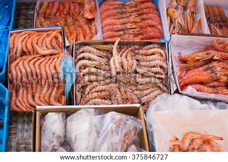 Assortment of cooled seefoods in show-case at fish market