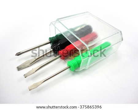 Four screwdriver in the plastic box isolated on white background