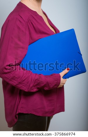 bright woman with blue folder for documents isolated studio