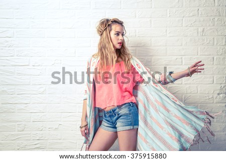 Boho Fashion Girl at White Brick Wall Background