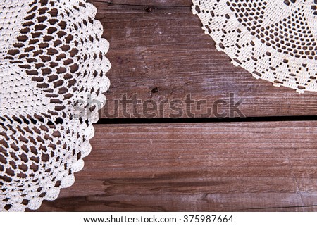lacy napkin on wooden background