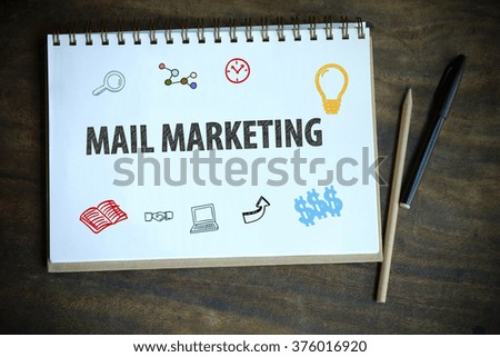 drawing MAIL MARKETING concept notebook on table wood , business concept , business idea