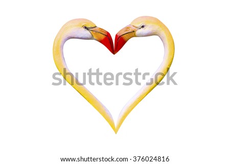 flamingos making a heart shape. (yellow heart shape)