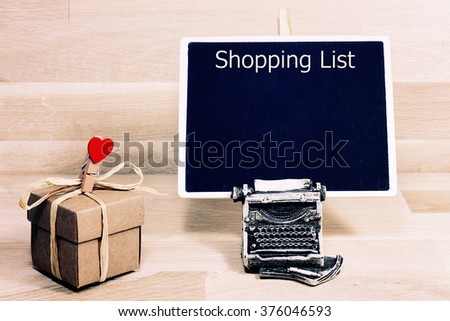 Shopping list written with white chalk on a blackboard 