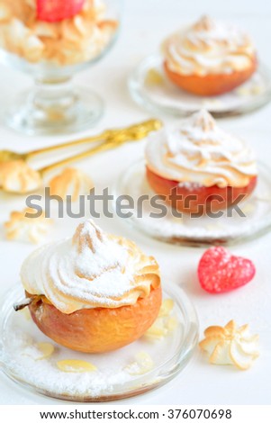 Baked apples with meringue - dessert on white