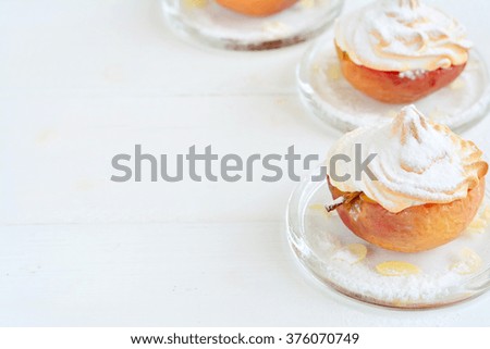 Baked apples with meringue - dessert on white with space for text (copy Space)