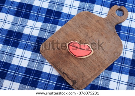 Mouth shaped cookies baked Valentine's Day on wooden tray