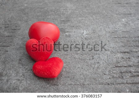 red heart on street and concrete.