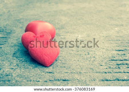 red heart on street and concrete.