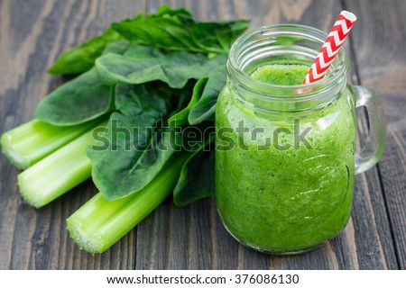 Green smoothie with celery, cucumber, spinach, apple and lemon Royalty-Free Stock Photo #376086130