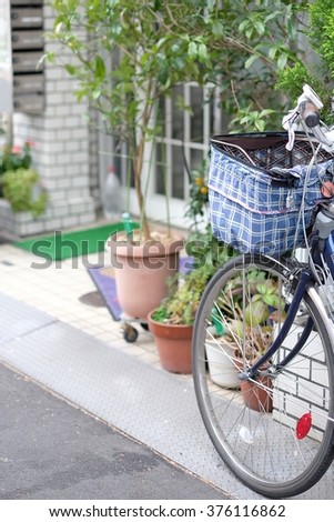Cute bicycle beside the street
Focus on bicycle