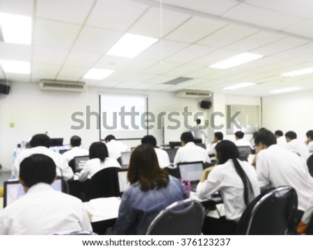 Blur student during study or lecture and quiz with teacher or professor in classroom with notebook in master degree of industrial management Engineering programs or MBA at Thailand university  Royalty-Free Stock Photo #376123237
