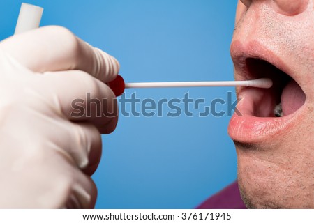 Man use a DNA test tube and cotton swab, wipe test Royalty-Free Stock Photo #376171945