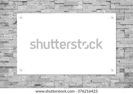 stone wall with white poster