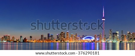 Toronto cityscape panorama at dusk over lake with colorful light. Royalty-Free Stock Photo #376290181