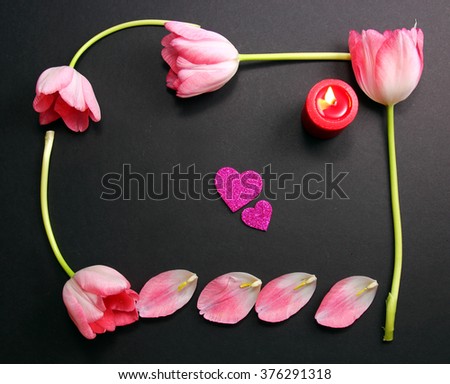 A pink Tulip frame with a candle and two pink hearts