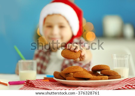 Cheerful boy writing a letter to Santa Claus, close up