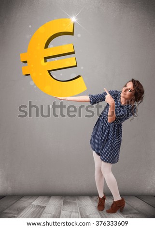 Beautiful young girl holding a big 3d gold euro sign