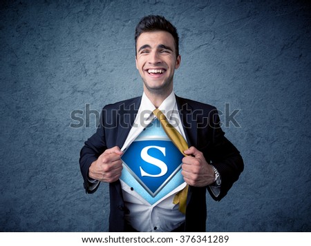 Businessman ripping off his shirt with superhero sign on his chest concept on background