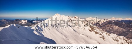 Winter mountains panorama with ski slopes. Caucasus panorama