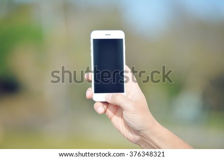 Person using a smart phone, close up photo