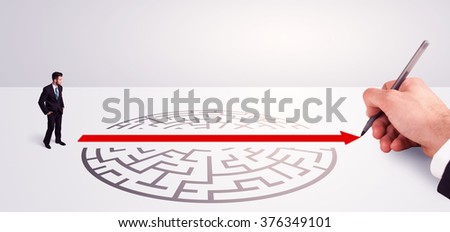 Hand drawing solution for successful businessman standing near the entrance of labyrinth
