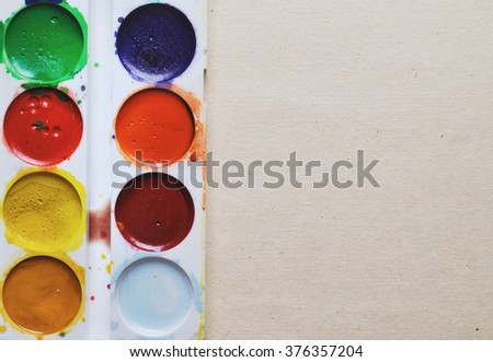 stained paints on beige old textured paper background