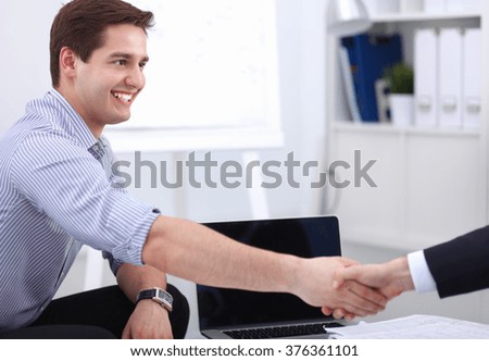 Businessmen shaking hands, isolated on white background