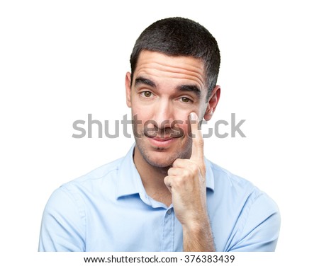 Close up of a young man with observation gesture