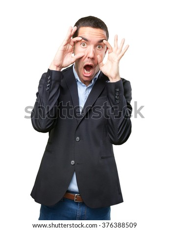 Shocked young businessman with observation gesture