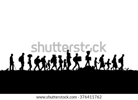 Silhouette of a group of refugees walking through a field Royalty-Free Stock Photo #376411762