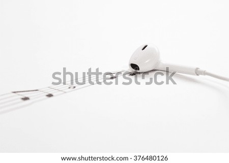 notes pouring out of the earphone